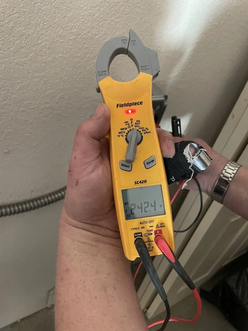Voltage testing with clamp meter during Generator Installation in Lakewood